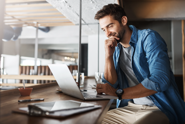 business-owner-life-insurance business owner looking at laptop shopping for insurance